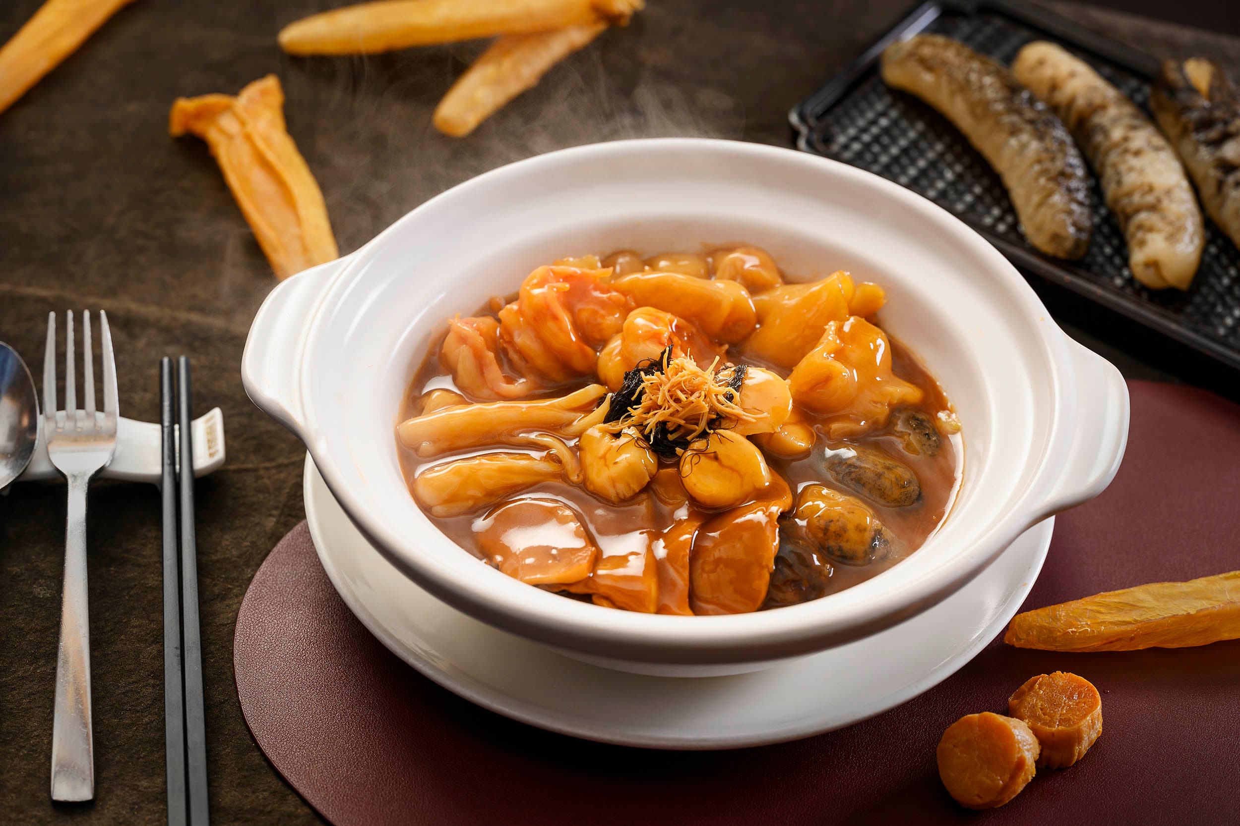 Assorted delicacies with seafood in pot
